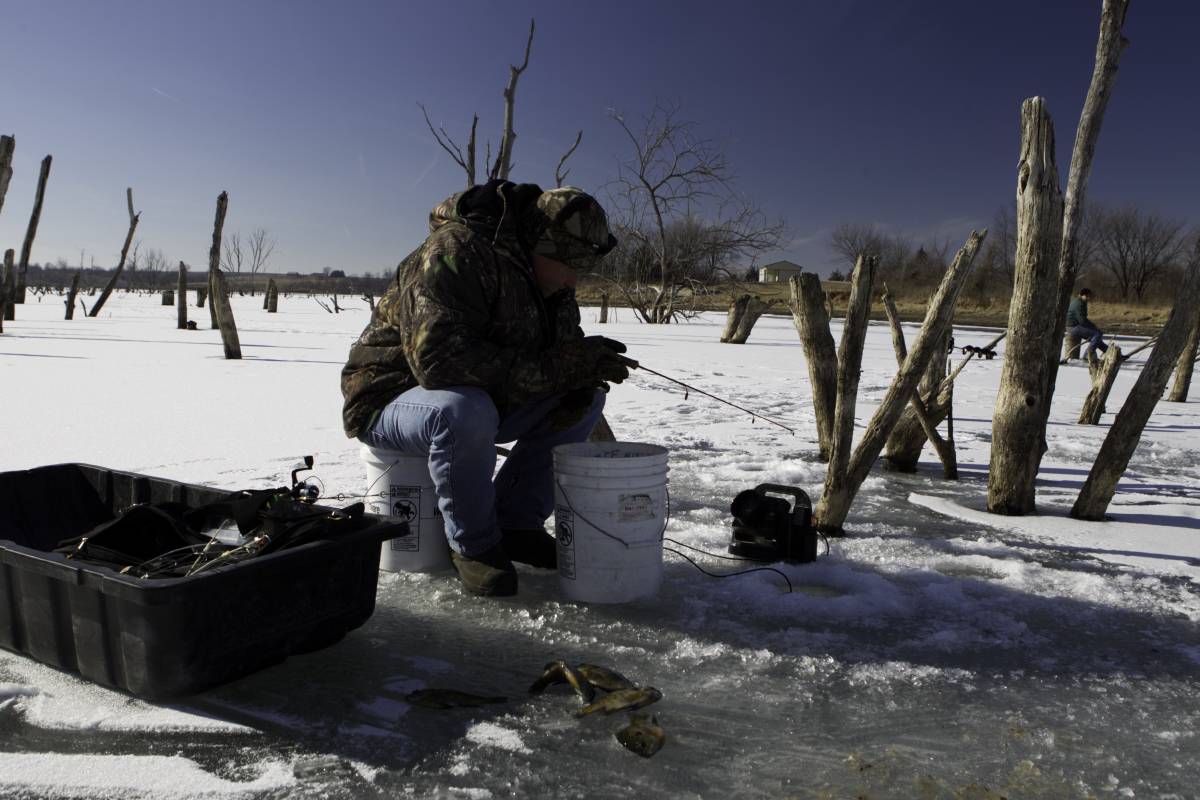 Man ice fishing 