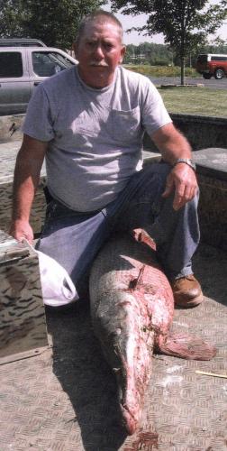 Larry Wolfe with his state record alligator gar