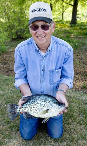 John Horstman holds his state record black crappie