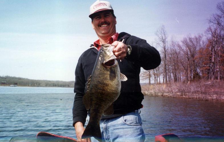 Mark Fann with his state record hybrid black bass