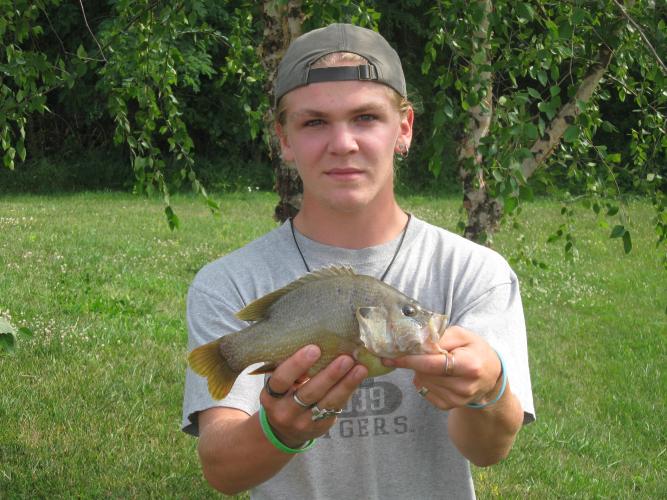 Bowen Dockery holds his record green sunfish