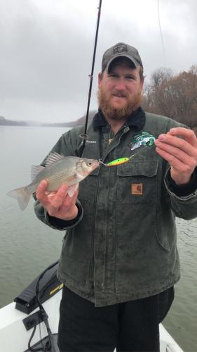 Bryant Rackers holds his state record white perch on the Osage River