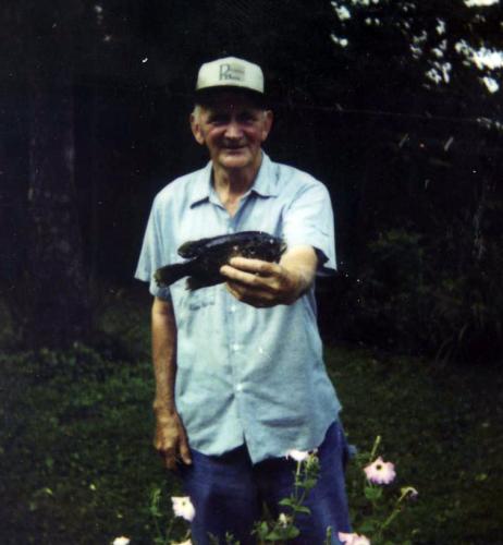 Eugene Stilts holding google-eye fish.