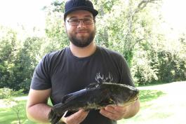 Cody Sparkman holds his new state record black bullhead catfish.